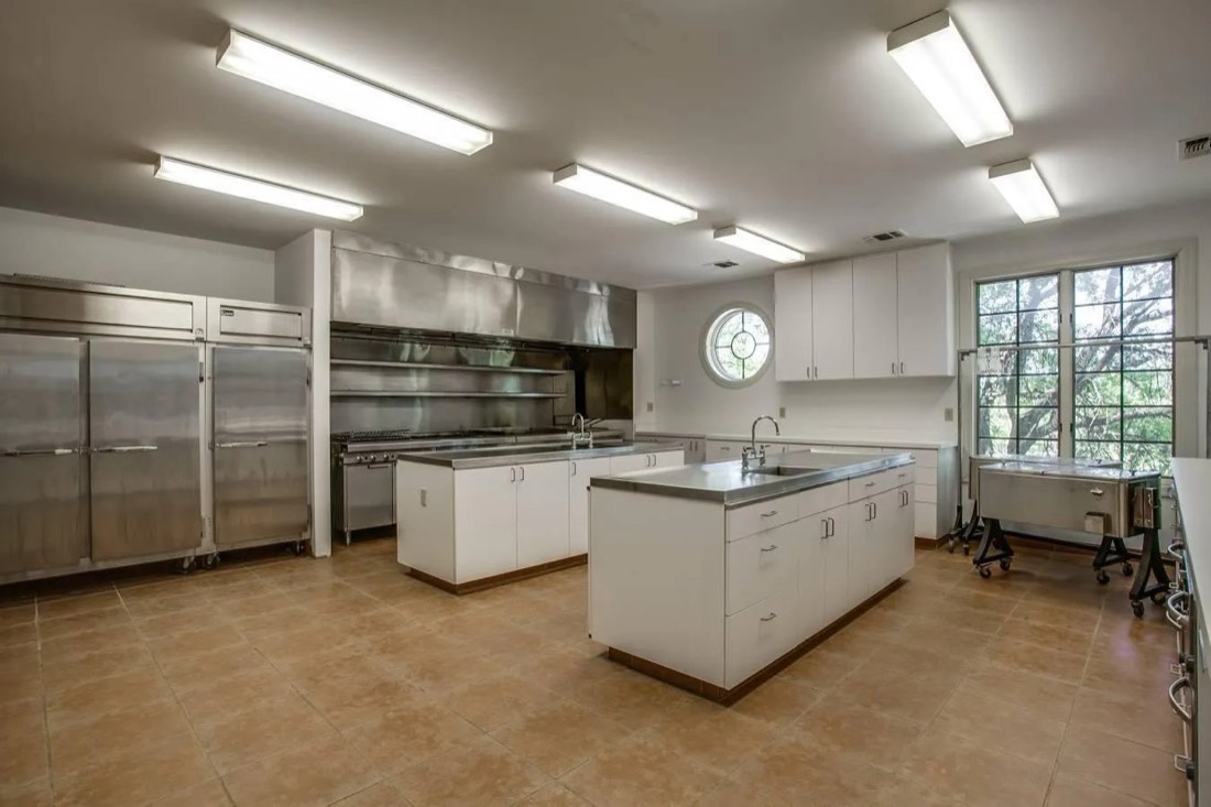 Commercial kitchen with stainless equipment and prep islands