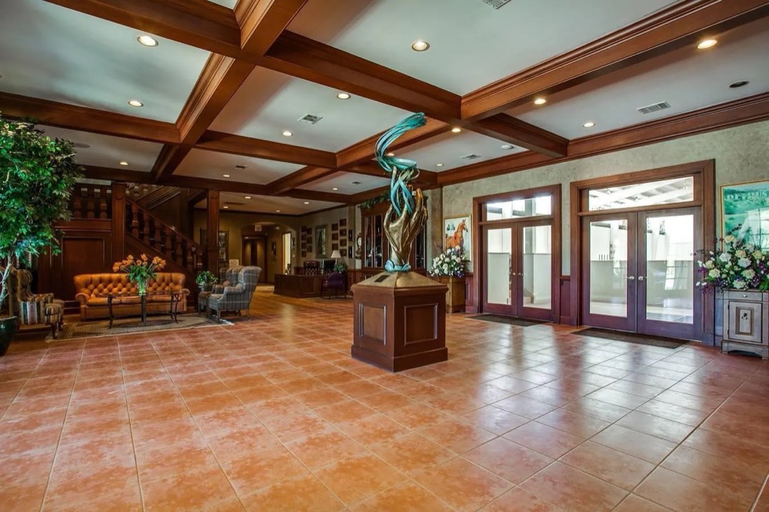 Grand lobby with coffered wood ceilings and bronze sculpture